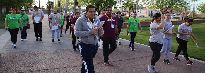 A group of people walking down a path