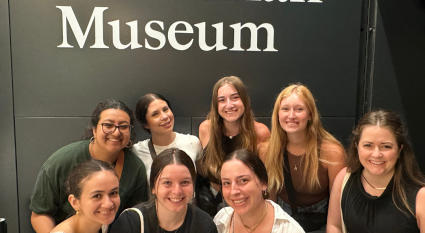 ASU Students pose with Assistant Professor Allie Peckham in front of the Hunterian Museum sign in London