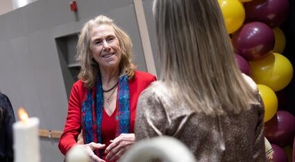 Edson College Dean Judith Karshmer smiles at a student. 