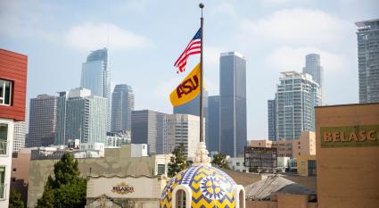  A view of the ASU and American flags flying atop the Herald Examiner building in downtown Los Angeles 